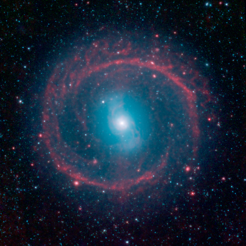 Cosmic Pinwheel Surrounds Distant Galaxy in Stunning NASA Photo